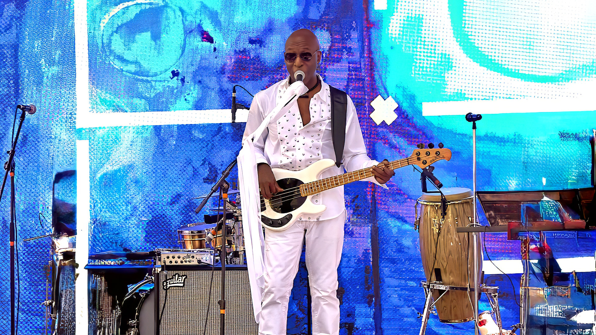 Kamaal Malak with his bass guitar in performance